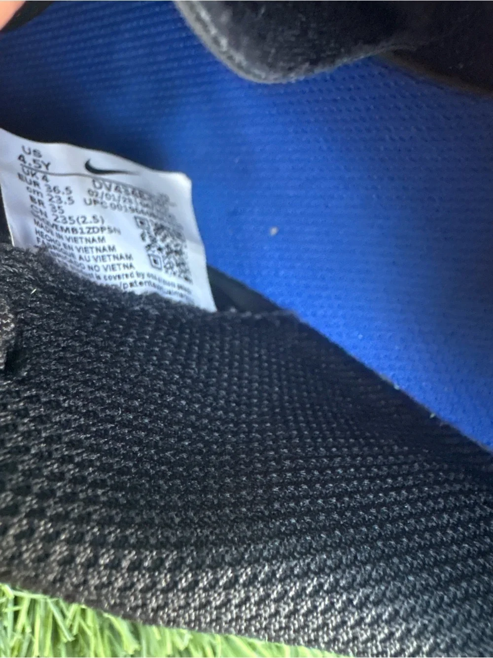 Nike Kids Black Soccer Cleats with Blue Accents